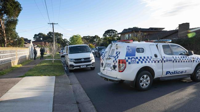 The house at Lesley Grove remains a crime scene as police depart. Picture: Tony Gough