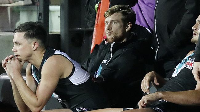 Tom Jonas looks in disbelief on the bench after injuring his knee on Saturday. Picture: Sarah Reed