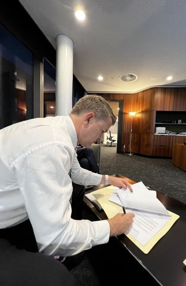 Queensland's new Deputy premier Jarrod Bleijie signing a letter confirming the cancellation of Pioneer-Burdekin. Picture: Facebook