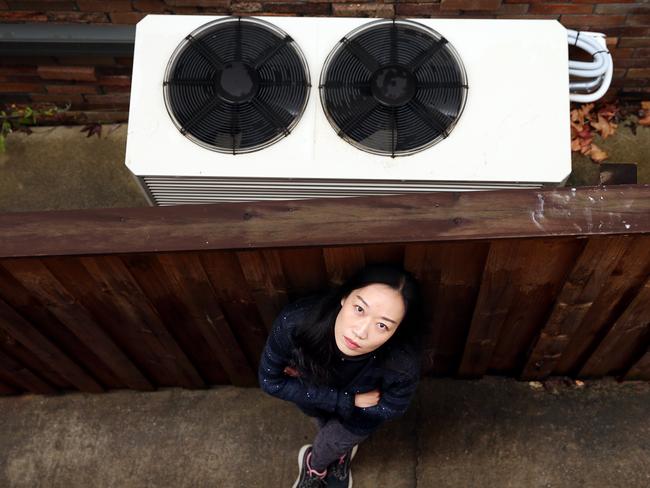 Nicole Li and her husband Neil are not happy with their neighbour’s air conditioning unit and have complained to police and council about it. Picture: Sam Ruttyn