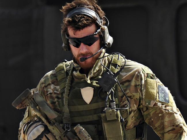 Australian Army soldier Corporal Benjamin Roberts-Smith, VC, MG, with the Special Operations Task Group, moves away from a United States UH-60 Black Hawk helicopter during preparations for the Shah Wali Kot Offensive in southern Afghanistan. *** Local Caption *** In June 2010, Afghan National Security Forces (ANSF) partnered with Australian special forces from the Special Operations Task Group to conduct a deliberate operation to clear a Taliban insurgent stronghold in the Shah Wali Kot region of northern Kandahar province.  The Shah Wali Kot Offensive comprised synchronised and deliberate clearance operations involving Australian commandos combined with a number of surgical helicopter-born assaults from Special Air Service (SAS) troops on key targets.  Removing Taliban insurgents from Afghan communities allows the Government of Afghanistan to establish a presence and gain the trust of the community to provide them with necessary infrastructure and security that was not provided by the insurgents.  The Shah Wali Kot Offensive was part of Australiaâs contribution to Operation Hamkari, an ISAF operation to extend the Government of Afghanistanâs influence into Kandahar City in southern Afghanistan. Picture: Department of Defence