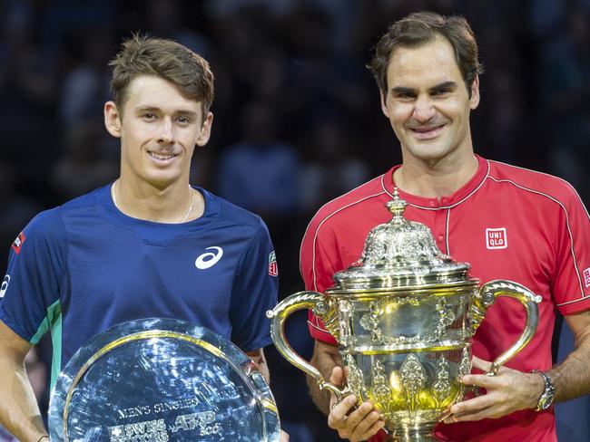 Switzerland's Roger Federer, right, and Australia's Alex de Minaur, left, pose after the final at the Swiss Indoors tennis tournament. Picture: Georgios Kefalas/Keystone via AP