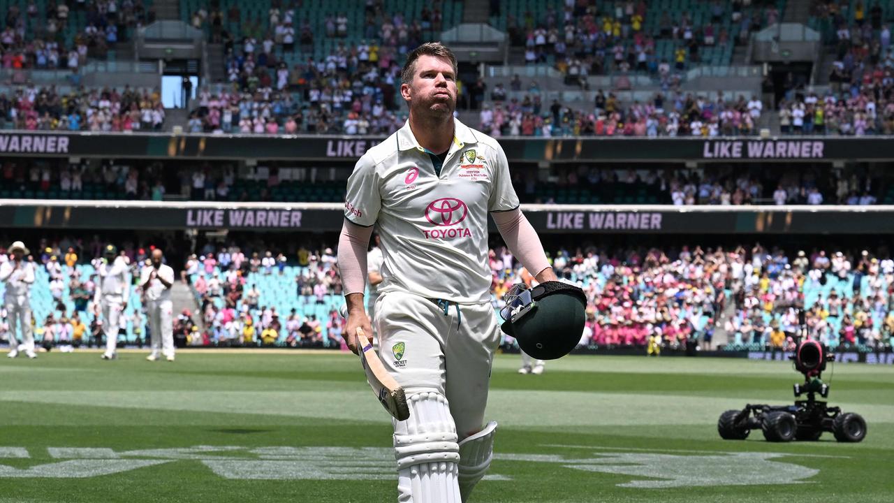 David Warner leaves the field for the final time as a Test batsman. (Photo by Saeed KHAN / AFP)