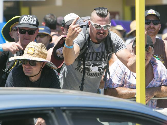 A Spectator eggs on a driver to preform a burnout on tough street at Summernats 31 Photo: Keegan Carroll