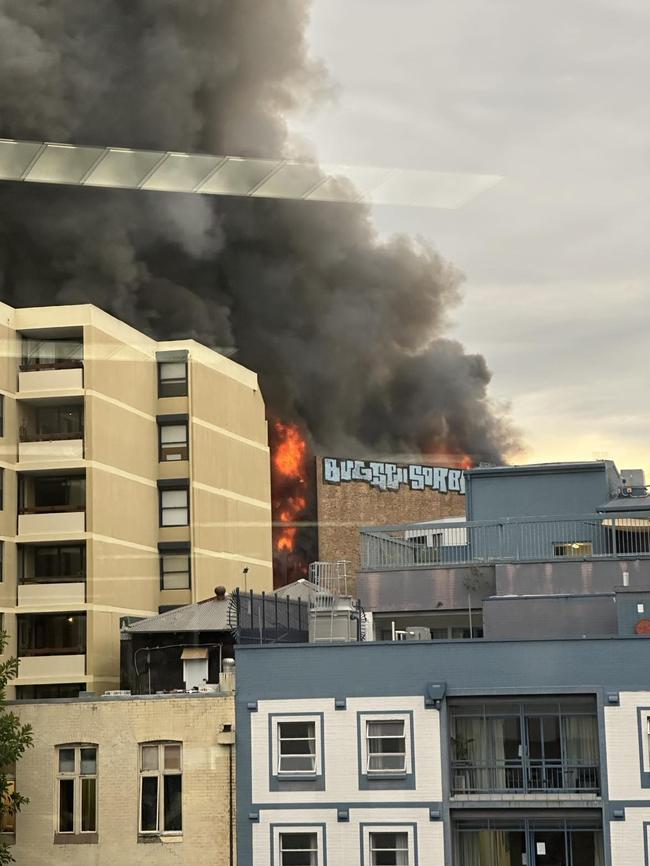 A “tornado” of smoke was seen coming from the building. Photo: Eli Green / NCA Newswire