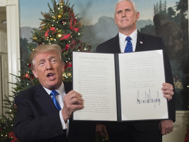 US President Donald Trump holds up a signed memorandum after declaring Jerusalem the capital of Israel. Picture: AFP/Saul Loeb