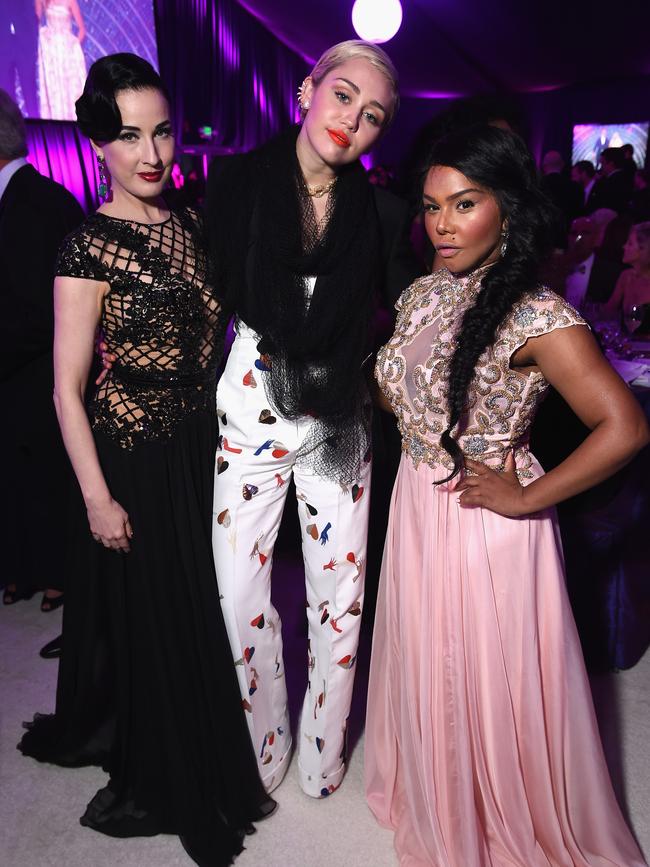 Dita Von Teese, Miley Cyrus, and Lil’ Kim attend the 23rd Annual Elton John AIDS Foundation Academy Awards Viewing Party. Picture: Getty