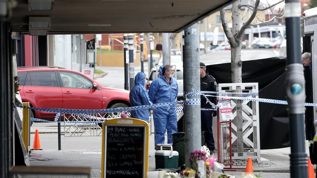 Tasmania Police forensic unit outside the shop where Voula Delios died in 2016. Picture: LUKE BOWDEN