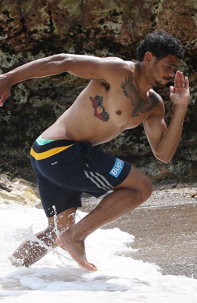 Cyril Rioli gets his work in on the beach. Picture: Wayne Ludbey