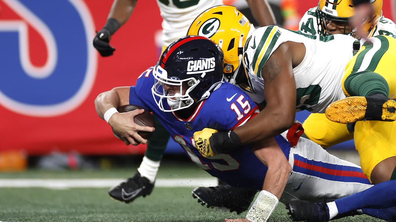 EAST RUTHERFORD, NEW JERSEY - DECEMBER 11: Tommy DeVito #15 of the New York Giants gets tackled at the one yard line by Kingsley Enagbare #55 of the Green Bay Packers after running for 26 yards during the third quarter in the game at MetLife Stadium on December 11, 2023 in East Rutherford, New Jersey. (Photo by Sarah Stier/Getty Images)