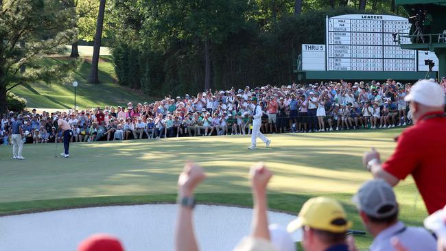 The gallery reacts as Scottie Scheffler makes birdie on the 16th hole of Augusta National during the final round of the Masters. Picture: Getty Images