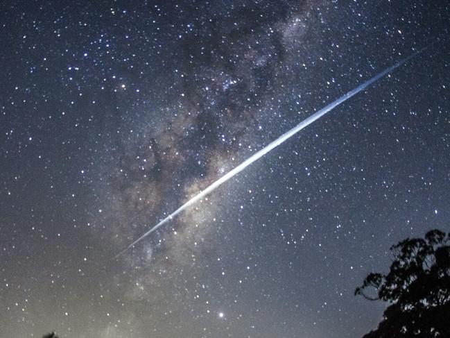 This image captured near Lethbridge shows about 40 of Elon Musk's Starlink satellites streaking through the night sky. The satellites appear as a streak due to the speed of their movement and the 30 second exposure of the shot. Picture: Rodd Westwood