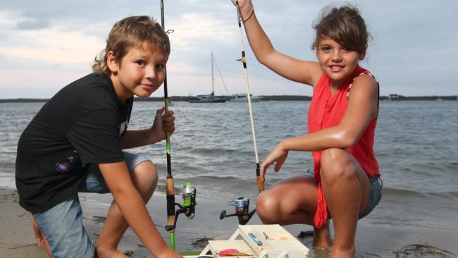 (L-R) Brodhi Dutton, 10 years, and Tia Dutton, 12 years fish at the Broadwater at Biggera Waters.