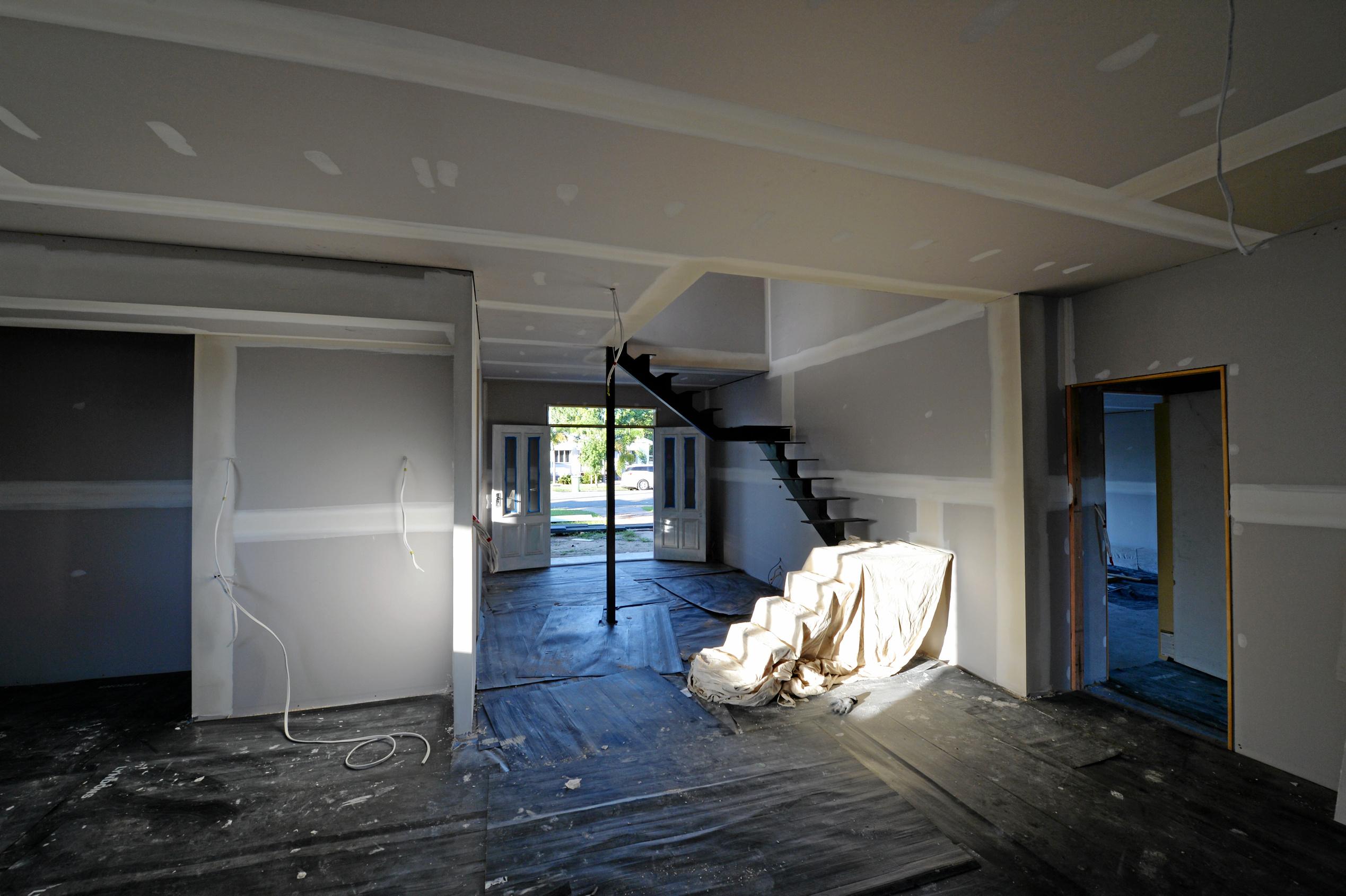 Mackay house-flippers Madison Strutynski and Michael Cotter at their Hunter St, West Mackay property. Picture: Stuart Quinn