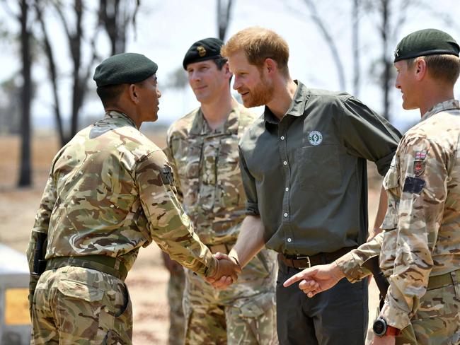 Britain's Prince Harry meets service personnel at the memorial site at the Liwonde National Park in Malawi. Picture: Dominic Lipinski/Pool via AP