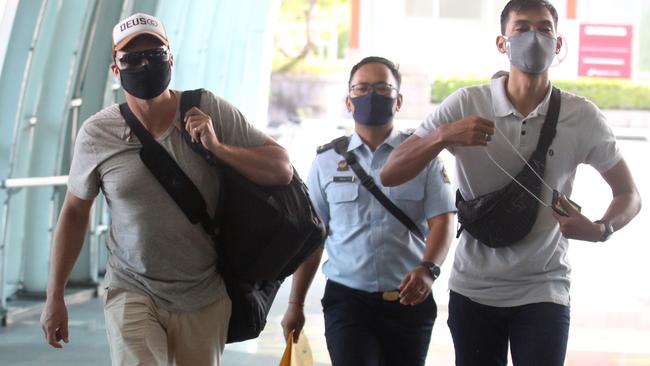 "NEWS360 PREMIUM LOCKED CONTENT: NO NEWS.COM, NO SKYNEWS, NO WEST AUSTRALIAN, NO AUSTRALIAN"Australian David Van Iersel escorted by Immigration officer to be deported to Australia after serving 9 month in Kerobokan jail. David and his friend William Cabantog were allegedly in posession 1.12 grams cocaine at Lost City Night Club in Canggu, North Kuta on July last year. (Picture. Lukman S. Bintoro)