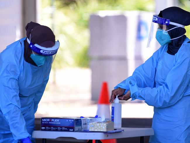 A NSW Health worker sanitises her hands between patients at a Sydney testing clinic. Picture: NCA NewsWire/Bianca De Marchi