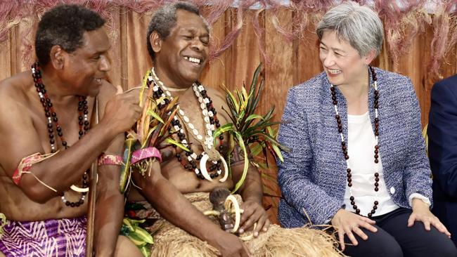 Foreign Minister Penny Wong sits beside chief Willie Plasua, president of the Malvatumauri Council of Chiefs, in Vanuatu on Monday. Picture: DFAT