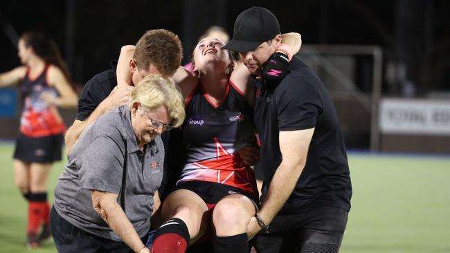 Souths captain Caitlyn Whipp is carried off the pitch after suffering a leg injury in the final minute of the Cairns Hockey Association A Grade Women's Grand Final between Souths and Saints. PICTURE: BRENDAN RADKE