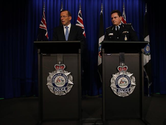 The Prime Minister Tony Abbott with AFP Commissioner Tony Negus. A hundred more AFP officers are flying to Europe to assist with securing the MH17 site.