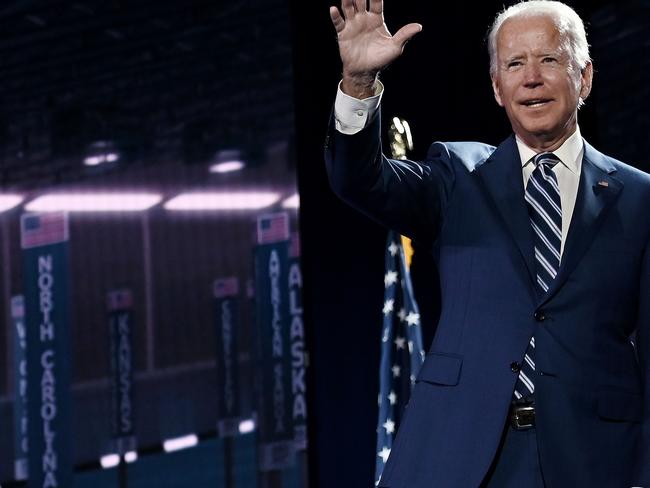 TOPSHOT - Former vice-president and Democratic presidential nominee Joe Biden waves on stage at the end of the third day of the Democratic National Convention, being held virtually amid the novel coronavirus pandemic, at the Chase Center in Wilmington, Delaware on August 19, 2020. (Photo by Olivier DOULIERY / AFP)