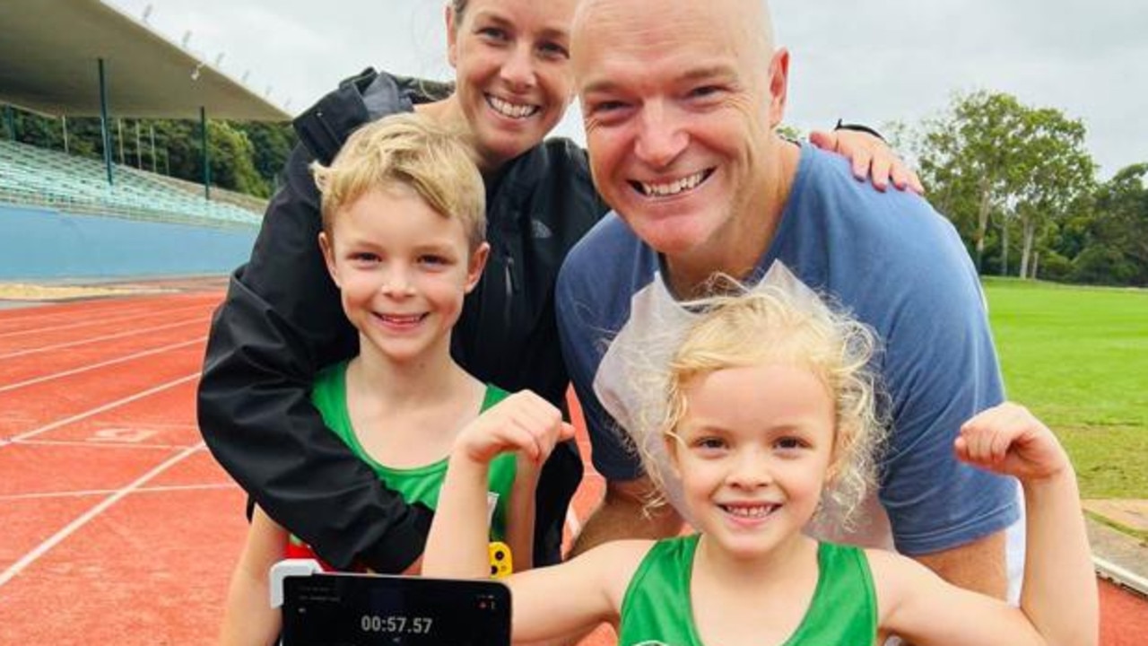 Little world champion Helena Carey with her proud family after setting a world record time on the track. Picture: supplied