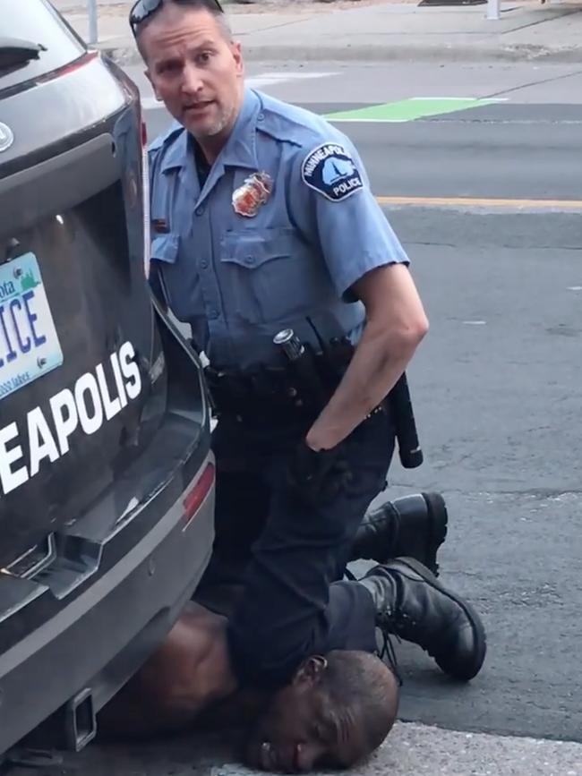 A policeman kneels on George Floyd’s neck shortly before he died. Picture: AFP