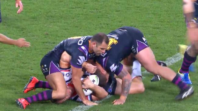 Cameron Smith works Mitchell Aubusson over in the ruck. Picture: Supplied