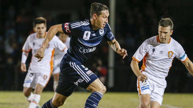Melbourne Victory’s Mark Milligan in action against Brisbane Roar on Wednesday night.