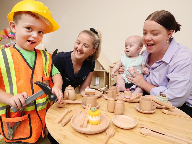 4 year old Hudson Lamb shows off his skills to Centre Director Kathryn Watson, sister Remi Lamb (5 months) and mother Bella Lamb at Edge Early Learning Centre at Pimpama Village. Picture Glenn Hampson