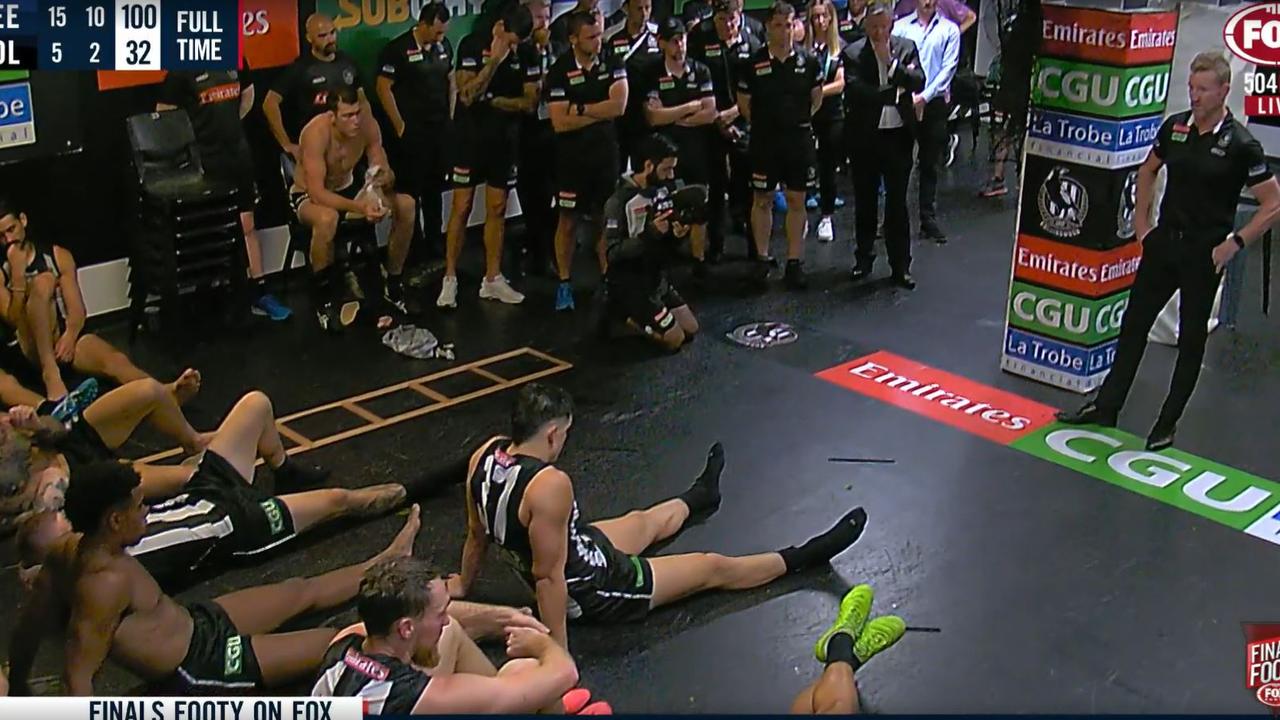 Nathan Buckley talks to his players after their massive semi-final loss to Geelong.