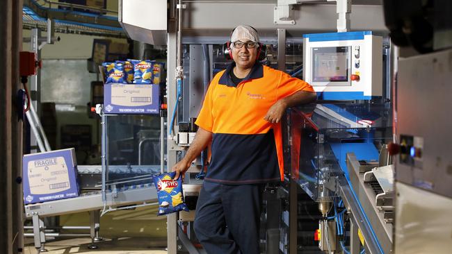 Machine operator Faraaz Abdullah posing at the Smith Chip Snack Foods in Brisbane.