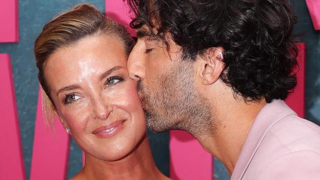 US actor Justin Baldoni kisses his wife Emily Baldoni as they attend the New York premiere of "It Ends With Us" at at AMC Lincoln Square in New York, August 6, 2024. (Photo by Charly TRIBALLEAU / AFP)