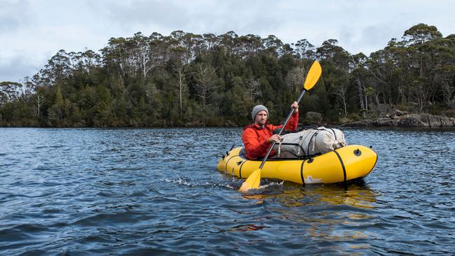 Walker and trout fisher Richard Webb leaves Halls Island on Lake Malbena in the Walls of Jerusalem National Park, the site of a proposed exclusive fly fishing eco-resort. Picture: CHRIS CRERAR