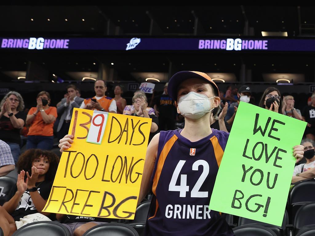 A support holds up a sign at Footprint Center in Phoenix. Picture: Christian Petersen/Getty/AFP