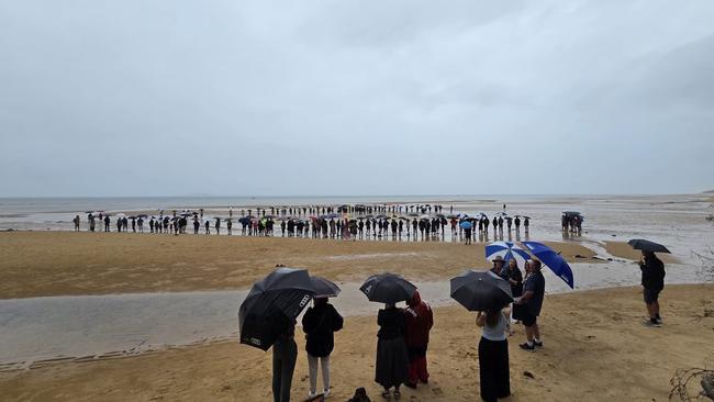 Crowds brought their umbrellas to the protest on a rainy day at Silverleaves Beach on January 6. Picture: Supplied