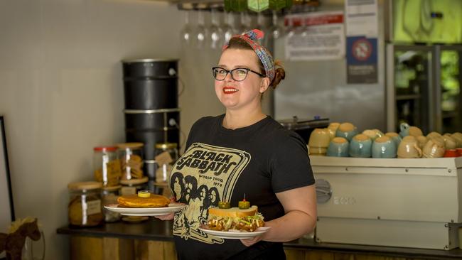 Dirty Doris owner/chef Denny Bradden with hthe chicken salad sandwich and pancakes. Picture: Roy VanDerVegt