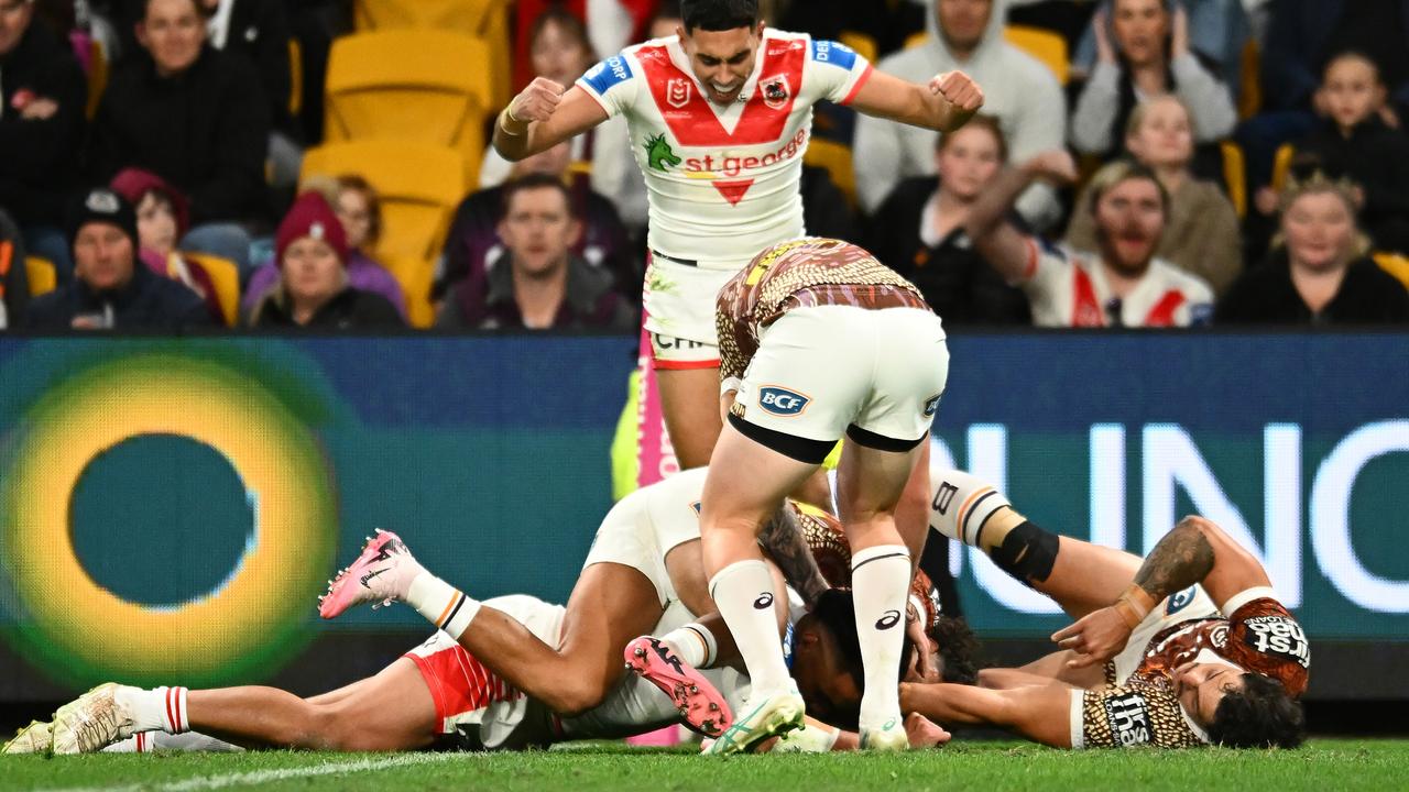 BRISBANE, AUSTRALIA - JULY 13: Christian Tuipulotu of the Dragons scores a try during the round 19 NRL match between Brisbane Broncos and St George Illawarra Dragons at Suncorp Stadium, on July 13, 2024, in Brisbane, Australia. (Photo by Albert Perez/Getty Images)