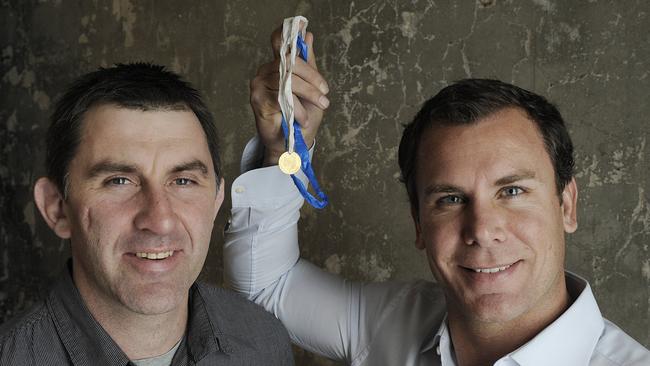 Corey McKernan and Wayne Carey with the fake Brownlow Medal presented to Corey by his teammates in 1996.