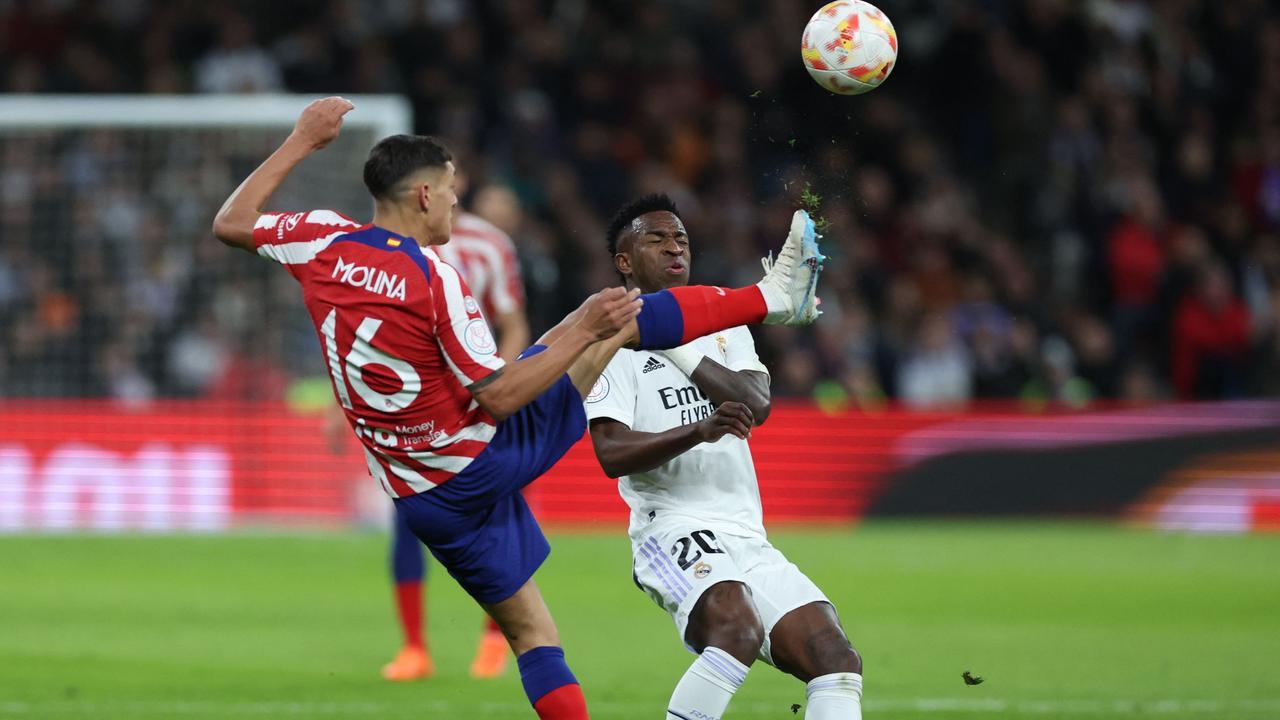 Atletico Madrid's Argentine defender Nahuel Molina (L) vies with Real Madrid's Brazilian forward Vinicius Junior during the Copa del Rey (King's Cup), quarterfinal.