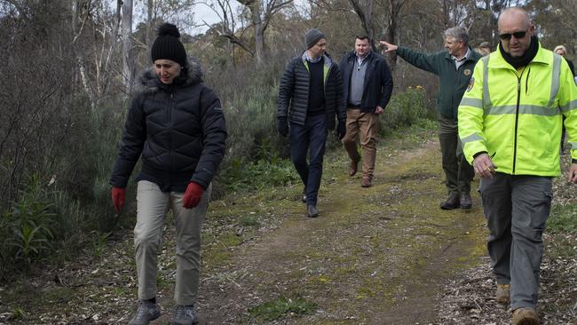 Premier Gladys Berejiklian (front left) and Environment Minister Matt Kean (second left) at Guula Ngurra National Park in the Southern Highlands. Picture: Sahlan Hayes