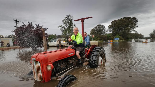 Echuca: Tractors and boats are favoured forms of transport through the flood water no matter how old they are. Picture: David Caird