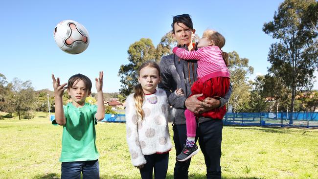 Ashbury resident Luke Buckle with his children Darcy, Gracie and Azalea at the Peace Park.