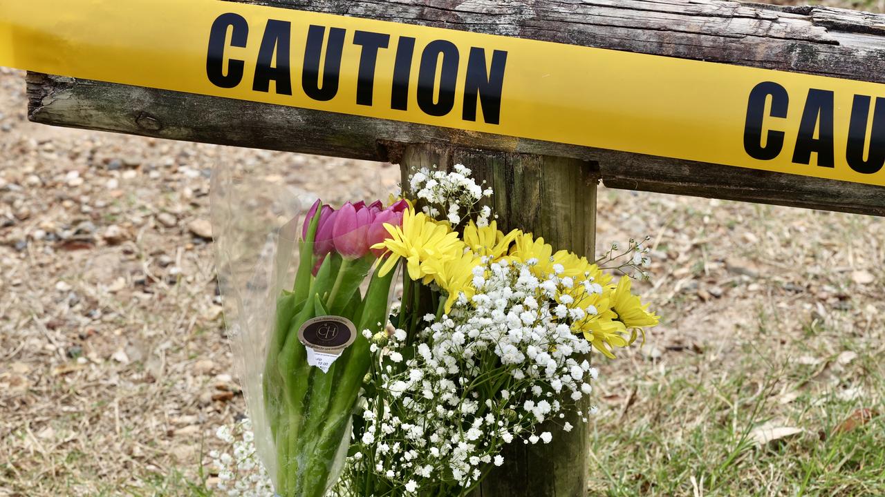 Flowers left near the scene of Sunday's tragedy at Holland Park. Picture: Liam Kidston