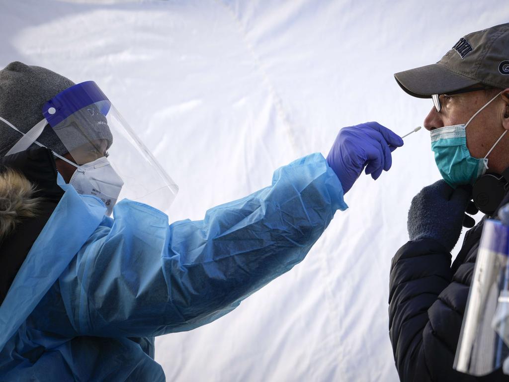 A man is tested for Covid-19 at a free testing site in Washington, DC. The US has broken daily global records for new cases. Picture: Getty Images/AFP