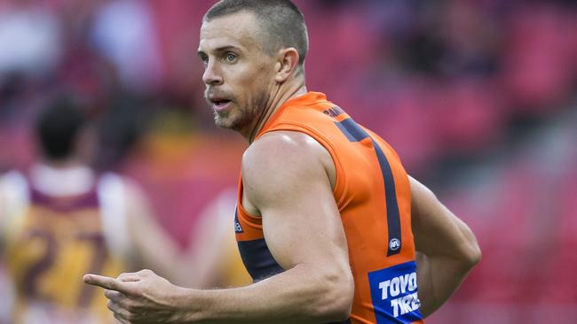 Brett Deledio celebrates a goal against Brisbane.