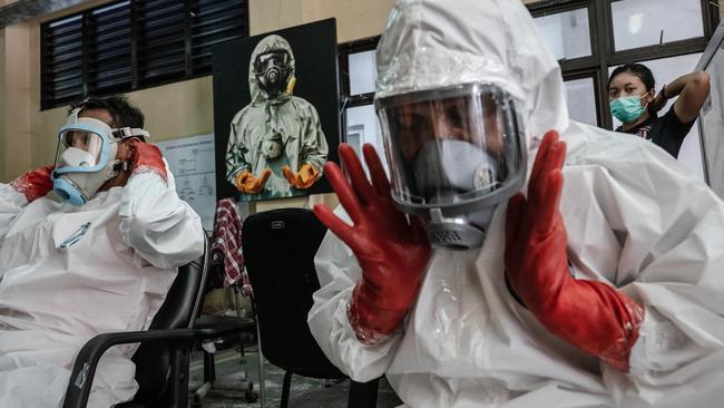 Volunteers and medical personnel in Yogyakarta, Indonesia. Picture: Getty Images