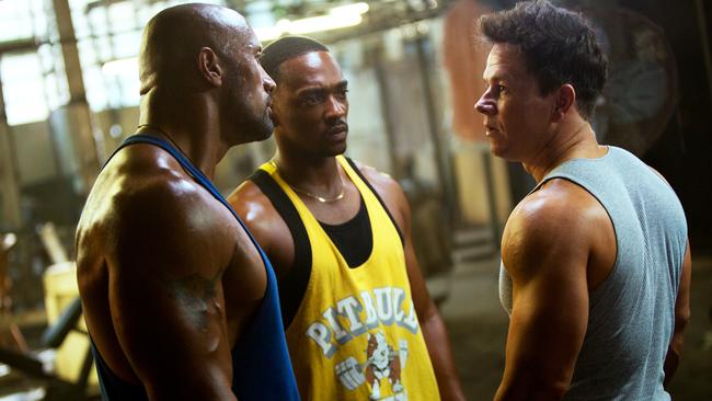 Dwayne Johnson, Anthony Mackie and Mark Wahlberg in a Pain and Gain. Picture: AP