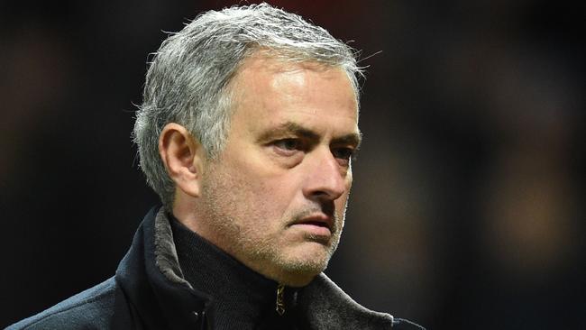 Manchester United's Portuguese manager Jose Mourinho leaves the pitch after losing a last 16 second leg UEFA Champions League football match between Manchester United and Sevilla at Old Trafford in Manchester, northwest England on March 13, 2018. / AFP PHOTO / Oli SCARFF