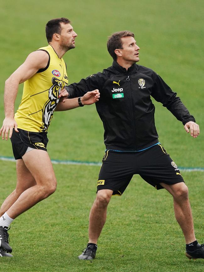 Richmond ruck coach Ivan Maric (right) works with Tigers big man Toby Nankervis at training. Picture: Michael Dodge/Getty Images